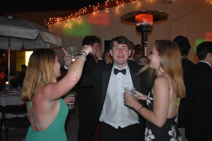 a group of people standing in a room